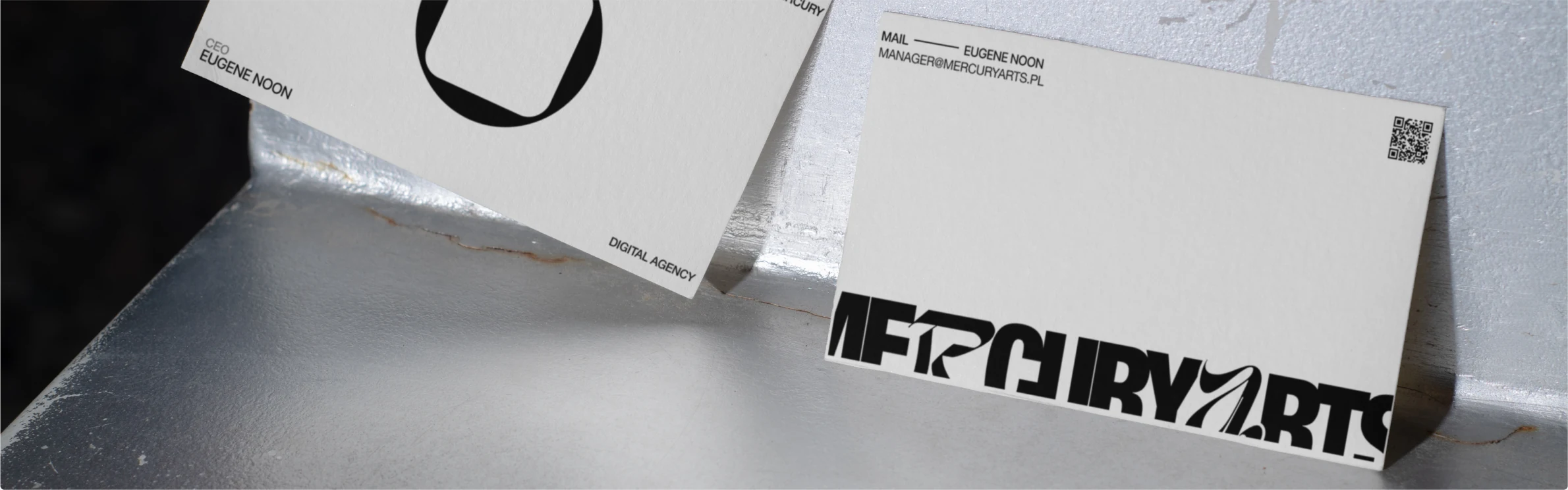 Mercury Arts — business cards on brushed steel